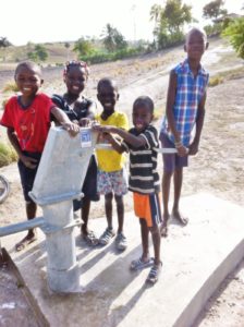 A mother and child receive life-saving water.